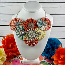 Load image into Gallery viewer, Turquoise &amp; Orange Fabric Flower Bomb with Vintage Pearl Pin
